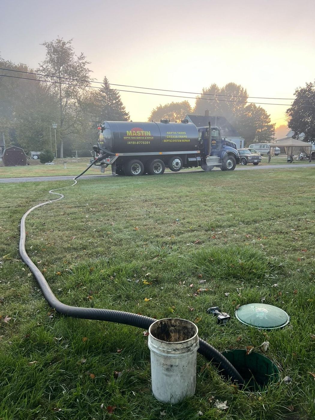Mastin technician pumping a septic tank in Northwest Ohio
