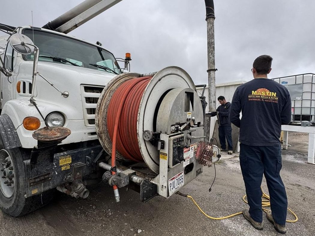 Mastin jetter and vacuum truck cleaning a manhole in Northwest Ohio