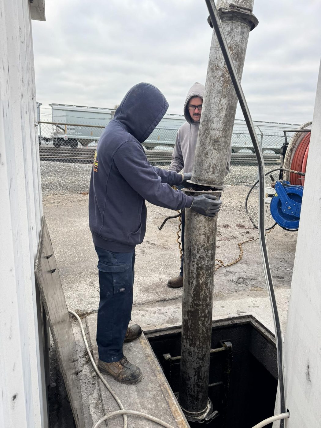 Mastin crew servicing a storm drainage structure